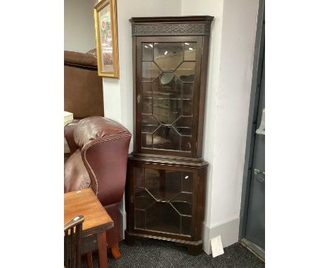 XVIII Century Style Mahogany Double Corner Cupboard, with a stepped pediment, blind fret frieze, glazed astragal doors, shape