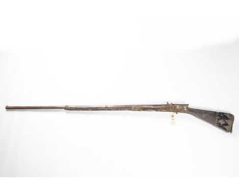 A once good 18th century Turkish miquelet flintlock gun, barrel 42" with some floral engraving at the breech, full length top