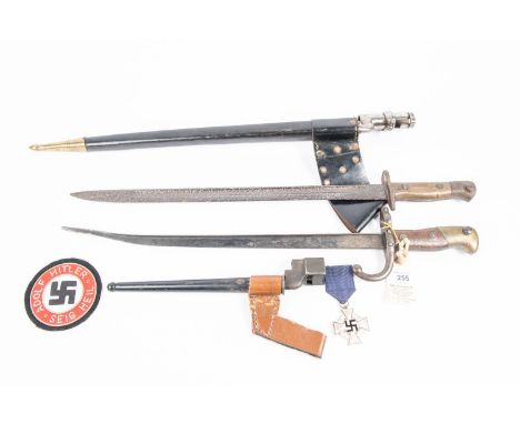 A French 1874 Gras bayonet (the blade shortened and bent); a 1907 SMLE bayonet (deeply pitted overall); a No 4 Mk II spike ba