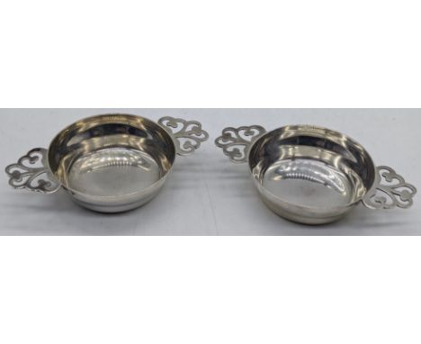 A pair of Arts and Crafts Scottish silver miniature quaich, hallmarked Edinburgh, 1916, maker Hamilton &amp; Inches, 60g, D.9