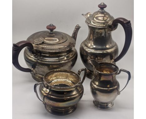 A silver tea set comprising of a teapot, waterpot, milk jug and sugar sifter, hallmarked Birmingham, 1935, maker possibly P&a