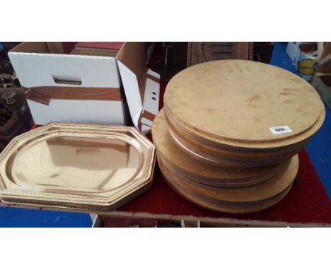 PROPS: A QUANTITY OF CIRCULAR PLACE MATS & GOLD COLOURED SERVING TRAYS.
