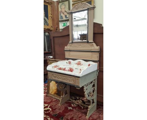 A WONDERFUL VICTORIAN CAST IRON WASHING TABLE with ceramic bowl and mirror back.