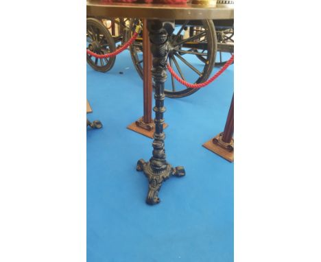 A BAR HIGH TABLE on cast iron decorative tripod base.