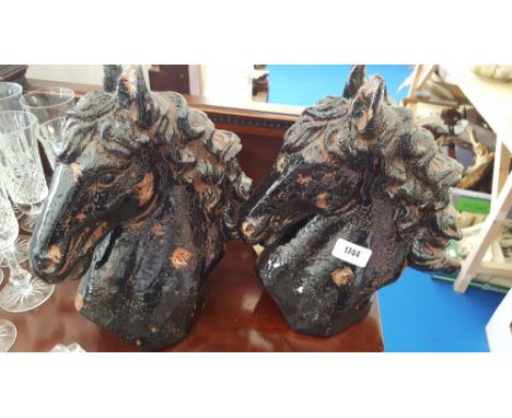 A PAIR OF CERAMIC HORSE HEADS