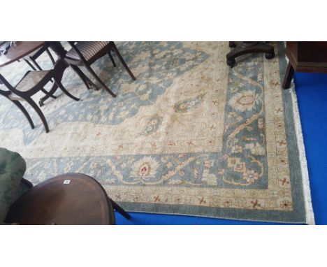 A LARGE ZIEGLER STYLE CARPET, BLUE AND CREAM GROUND with central medallion and multi borders. 16' 6" x 10' 6". (Match to Lot 