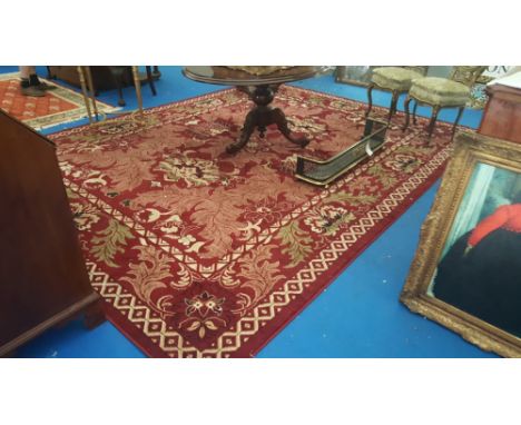 A LOVELY TURKISH MESHKABAD DESIGN CARPET ON DEEP RED GROUND, with all-over decoration in cream and greens. 4m x 3m. (Match to