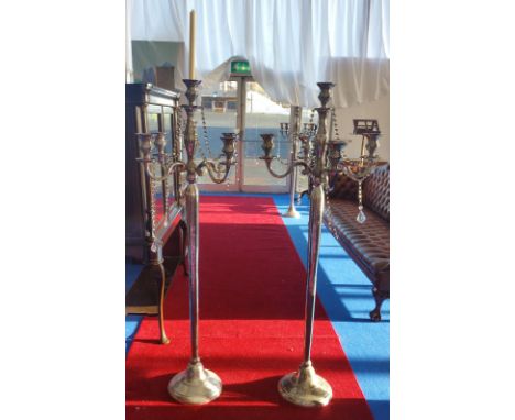 A LARGE PAIR OF FOUR BRANCH CANDLESTICKS (Dorian's Portrait Room).