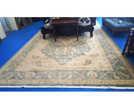 A LARGE ZIEGLER STYLE CARPET, BLUE AND CREAM GROUND with large central medallion and multi borders. 16ft 6ins x 10ft 6ins.  (