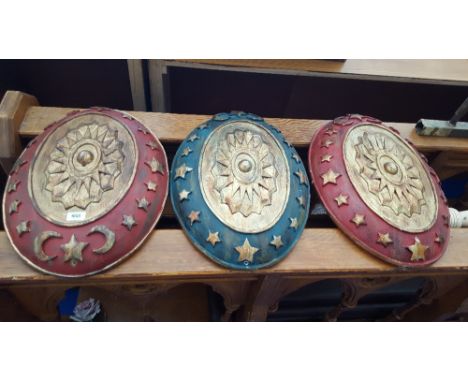 PROPS: THREE MODERN WALL HANGING SHIELDS MOTIFS, A MOUNT, ETC.
