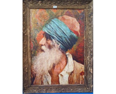 A.T.O. A COLOURED PRINT of an elderly eastern gentleman wearing a turban, framed. 31" x 41".