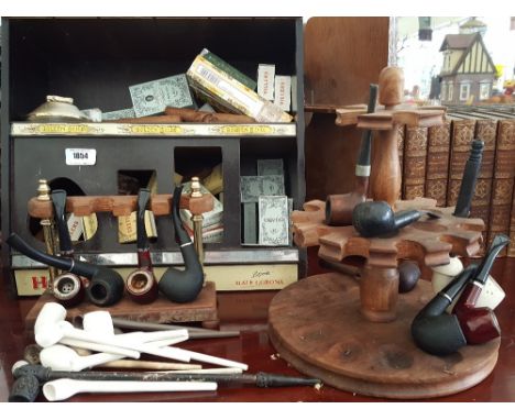 A GOOD COLLECTION OF VINTAGE PIPES, CIGARS, pipe holders and a Hamlet display cabinet.