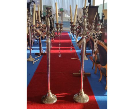 A LARGE PAIR OF FOUR BRANCH CANDLESTICKS (Dorian's Portrait Room).