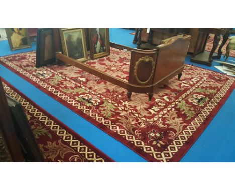 A LOVELY TURKISH MESHKABAD DESIGN CARPET ON DEEP RED GROUND, with all-over decoration in cream and greens. 4m x 3m. (Match to