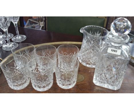 A SQUARE CUT WHISKEY DECANTER, SIX TUMBLERS & WATER JUG.