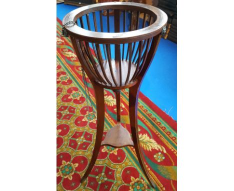 AN EDWARDIAN MAHOGANY INLAID PLANTER.