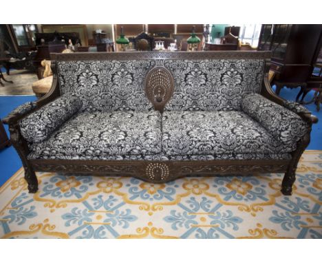 A WONDERFUL HARDWOOD COUCH OF LARGE PROPORTIONS with highly carved back, consisting of an inlaid peacock in the centre, on ca
