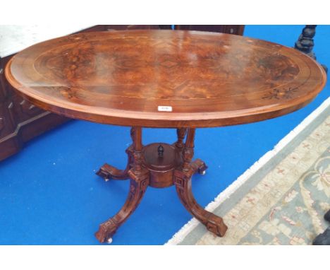 A 19TH CENTURY WALNUT AND BURR WALNUT OVAL LOO TABLE. (Dorian's Portrait room).
