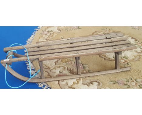 A LATE 19TH/EARLY 20TH CENTURY CHILD'S SLED, approx. 3' 6" long.