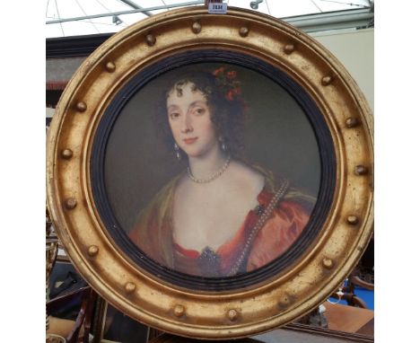 A.T.O. A CIRCULAR PORTRAIT PRINT of a young lady in a red dress in an ornate 19th century gilt frame. 25.5" diameter.