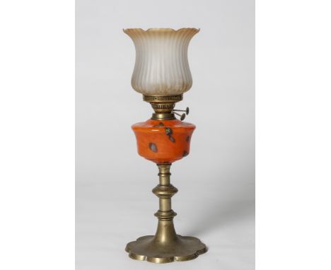 A LOVELY EARLY 20TH CENTURY BRASS OIL LAMP with orange speckled glass bowl and amber shade.