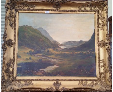 A.T.O. A  LARGE COLOURED PRINT of a highland scene in a 19th century gilt frame. 39.25" x 34.5".
