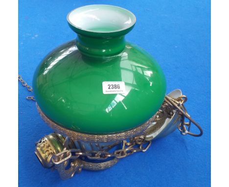 A MODERN POLISHED BRASS HANGING OIL LAMP of neat proportions fitted with a green glass shade.