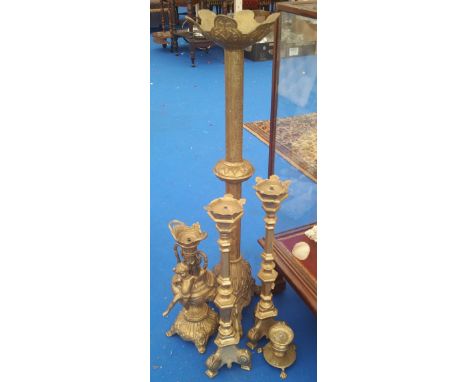 A GOOD GROUP OF BRASS PRICKET STYLE CANDLESTICKS and a good brass lamp base.