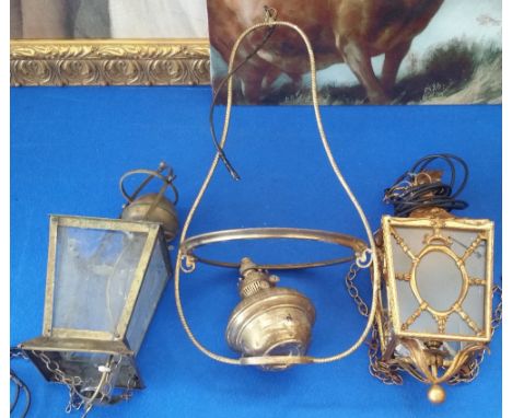 THREE BRASS CEILING LIGHTS to include a decorative modern square example, an oil lamp with a square shade and a large circula