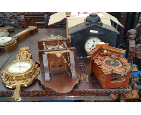 A GROUP OF FOUR CLOCKS to include a modern cuckoo clock.