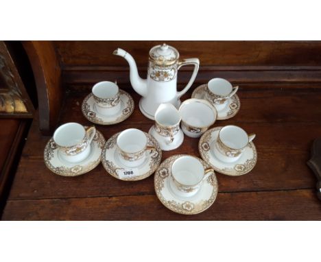 A NORITAKE GILT DECORATED COFFEE SET FOR SIX.