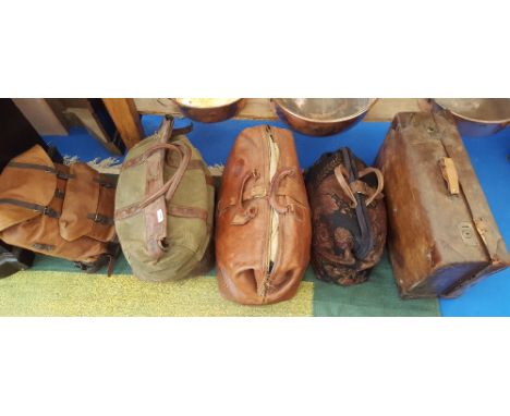 A GROUP OF FIVE LEATHER AND CARPET TRAVELLING BAGS.