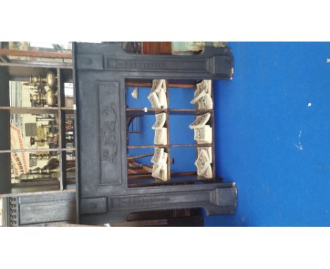 AN EBONISED FIRE SURROUND.