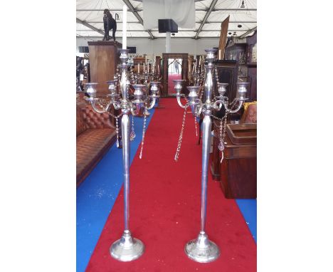 A LARGE PAIR OF FOUR BRANCH CANDLESTICKS (Dorian's Portrait Room).