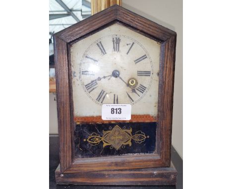 A PINE CASED GERMAN WALL CLOCK of small proportions.