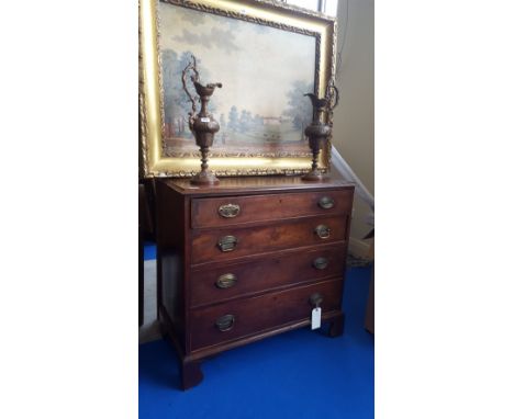 A GOOD GEORGIAN CHEST OF DRAWERS with four graduated drawers with brass handles and standing on bracket feet.