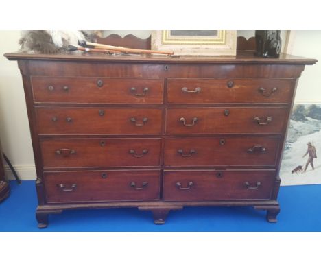 A WONDERFUL EARLY GEORGIAN MAHOGANY MULE CHEST with false and real drawers to the front and lift up lid on ogee bracket feet.