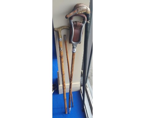 A SHOOTING STICK, SWAGGER STICK & TWO WALKING STICKS.