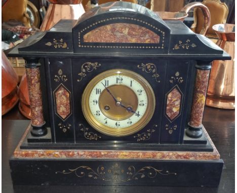 A FRENCH BLACK MARBLE MANTEL CLOCK with a gilt brass bezel and gilt detail to main structure.