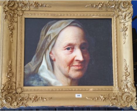 A.T.O. A COLOURED PORTRAIT PRINT of an elderly lady in a highly ornate frame. 33" x 28".
