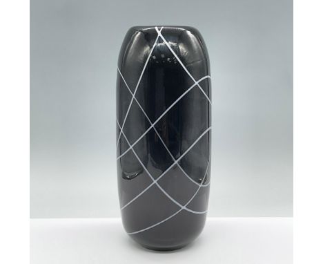 A glossy vintage black glass cylindrical vase with a series of intersecting curved white lines. Issued: 20th centuryDimension