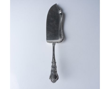 A sterling silver fish server by Gorham in the Chantilly pattern, first introduced in 1895. The handle is adorned with the ic