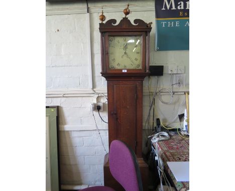 An early 19th century oak longcase clock, with ball finials over a painted dial with date aperture, name rubbed, the thirty h