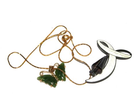 A Jade butterfly pendant and chain, and a silver and enamel brooch 