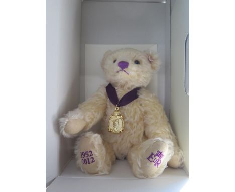 A Steiff Diamond Jubilee teddy bear, with medal and certificate, boxed, 26 cm long 