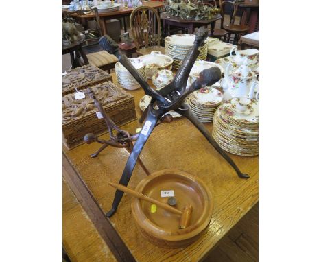 Two African hardwood folding stands, with head terminals, 58 and 34 cm long, and a New Zealand wood sample nut cracker and bo
