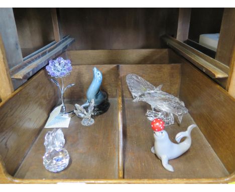 Swarovski and other crystal ornaments, a Poole Pottery figure of a seal and another by Villeroy &amp; Boch of a seal balancin