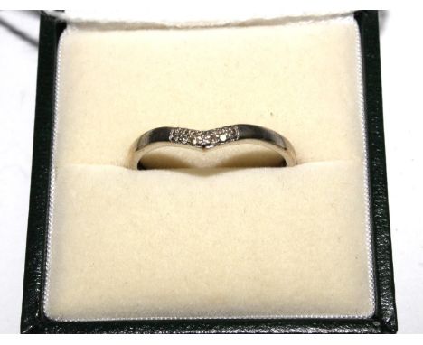 A diamond set white colour metal wish bone ring 