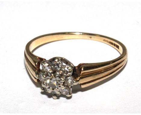 A small diamond cluster ring set in 9 carat gold 