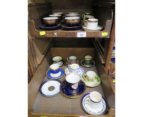 A collection of cabinet cups and saucers, including a set of six German blue and gilt, Royal Crown Derby, Old Foley and other